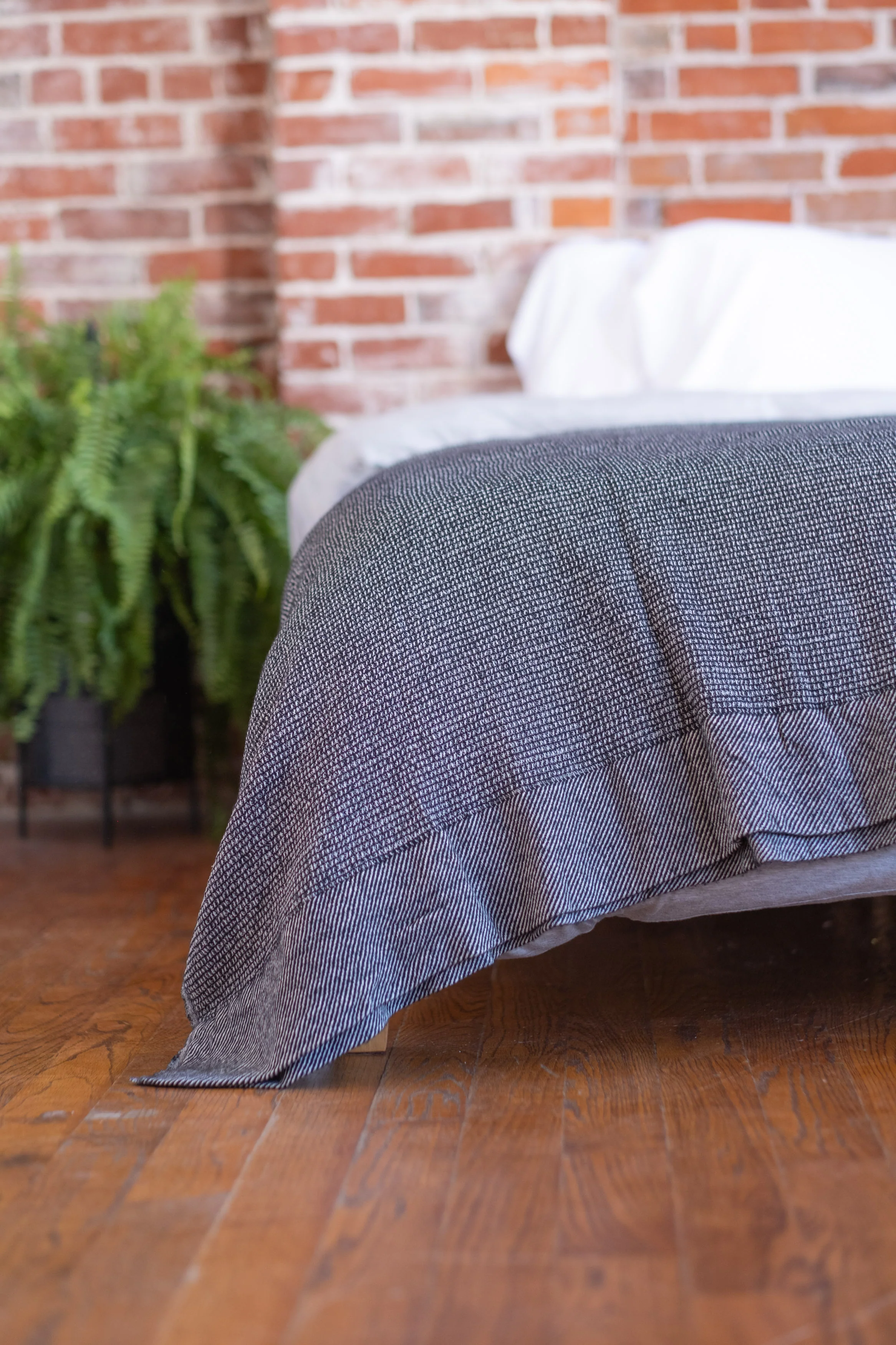 The Micro Waffle Wool Blanket in Charcoal - Image 5