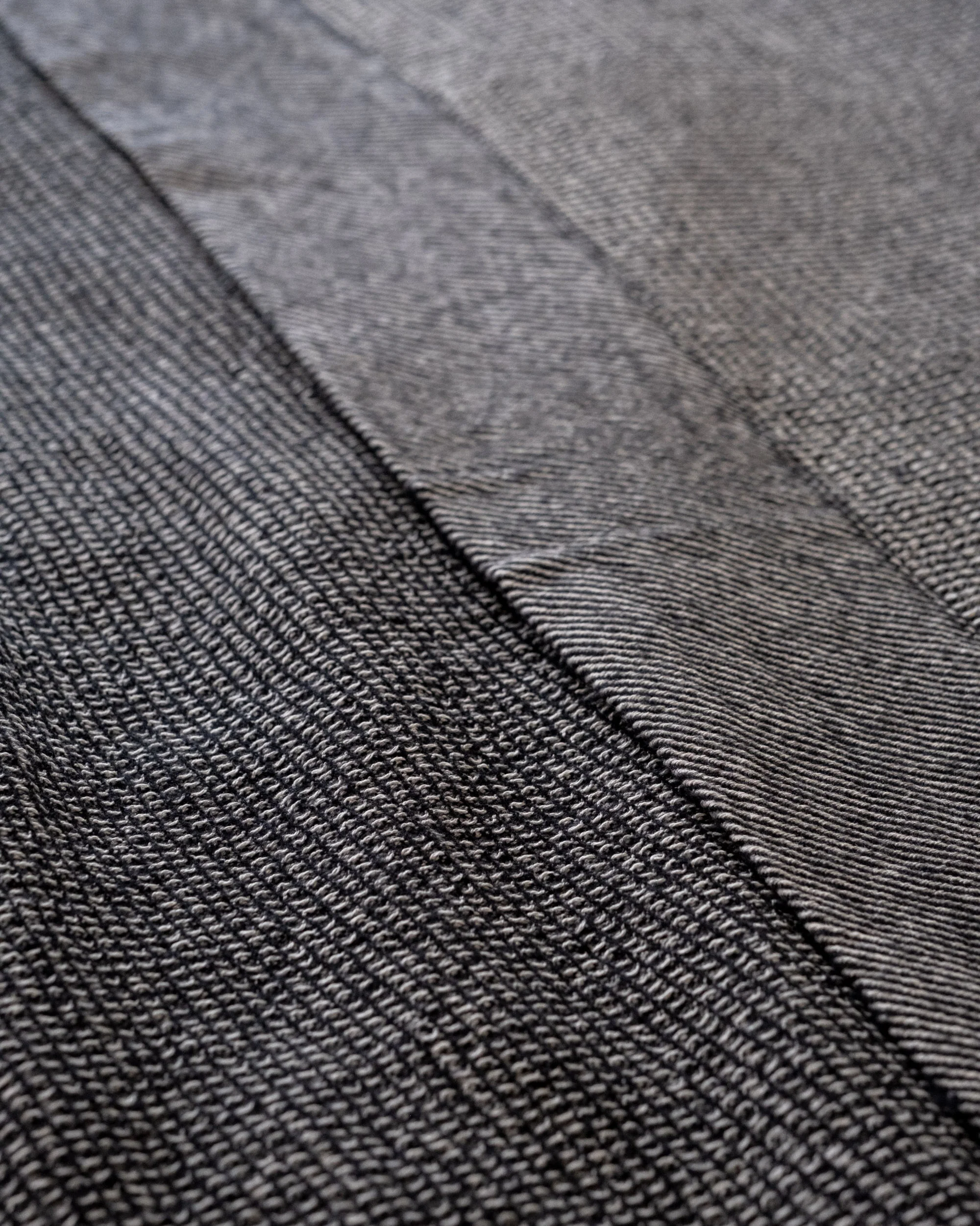 The Micro Waffle Wool Blanket in Charcoal - Image 7