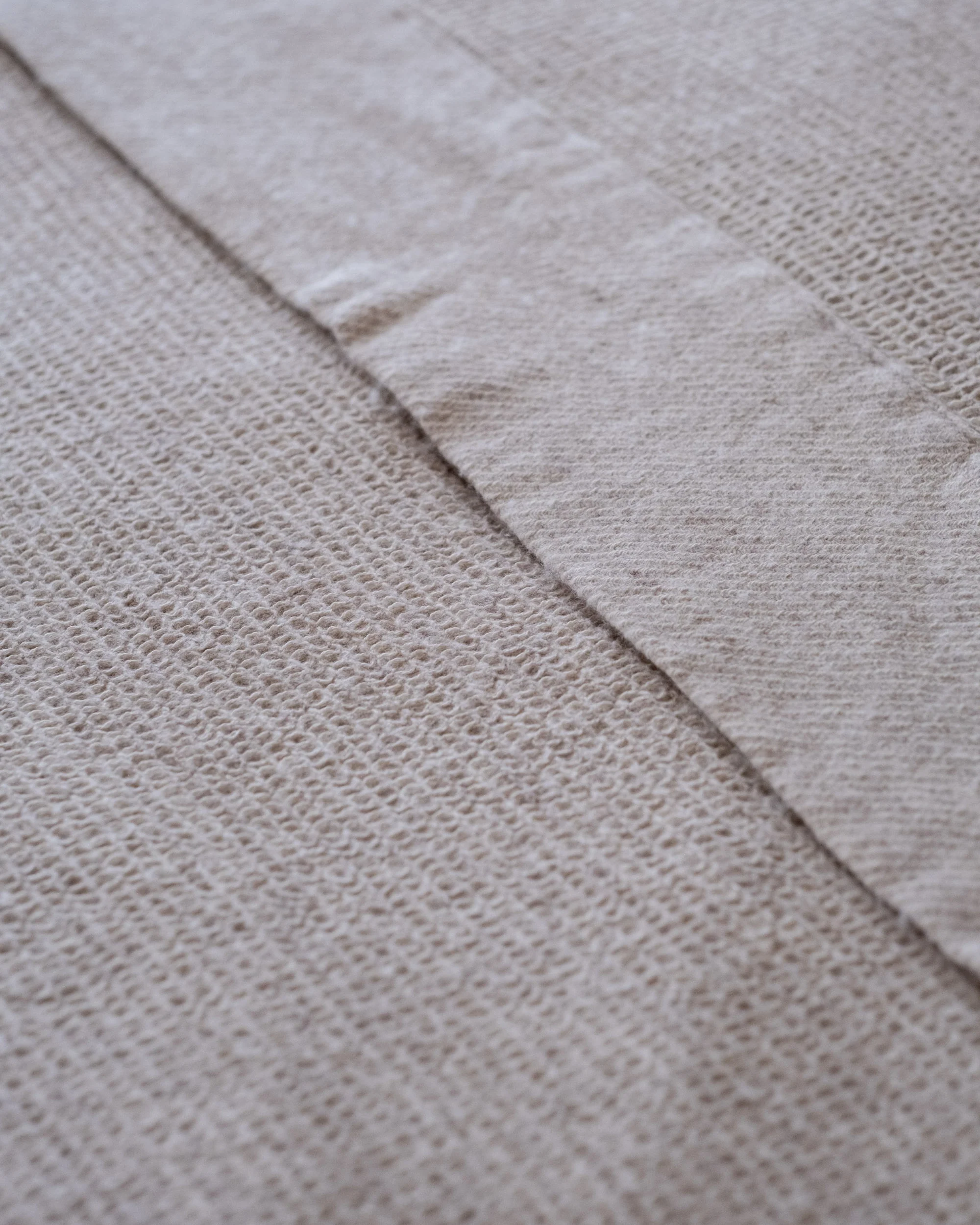 The Micro Waffle Wool Blanket in Bone - Image 9